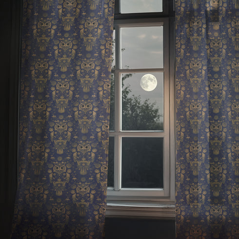 A sheer curtain panel featuring a repeating pattern of ornate golden owls surrounded by delicate floral designs and botanical elements on a deep navy background. The fabric has a fine linen-like texture with translucent qualities.